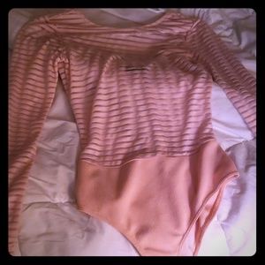 A shear stripe soft pink bodysuit